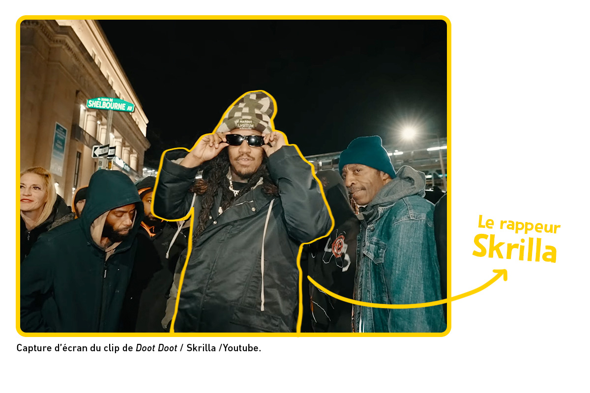 capture d'écran du clip de Doot Doot. on y va le rappeur Skrilla avec des lunettes de soleil et un bonnet.